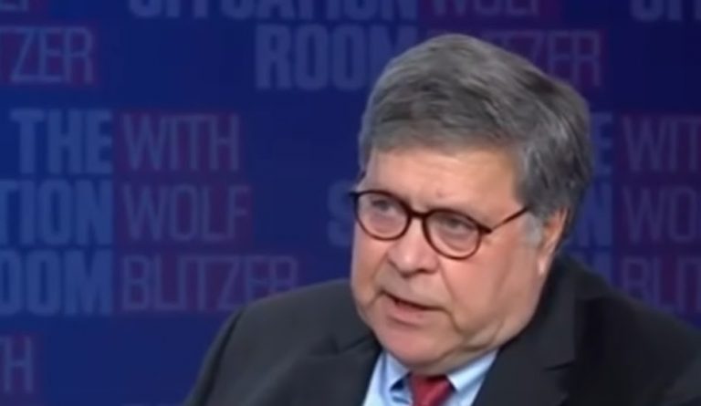 us attorney general william barr of the u.s. justice department speaking in a screenshot on blue background