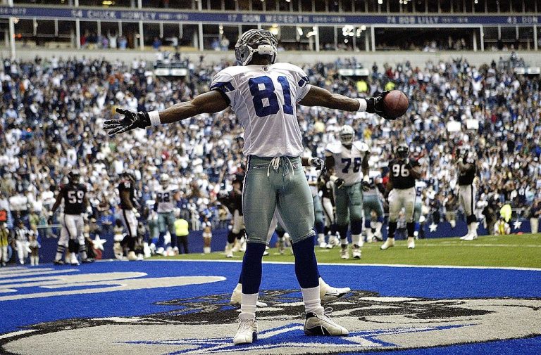 Wide receiver Terrell Owens #81 of the Dallas Cowboys celebrates his third touchdown against the Houston Texans on October 15, 2006 at Texas Stadium in Irving, Texas. Texas Governor Greg Abbott removed the state’s masking requirement and business capacity restrictions from his administration’s pandemic measures on Tuesday, Mar. 2