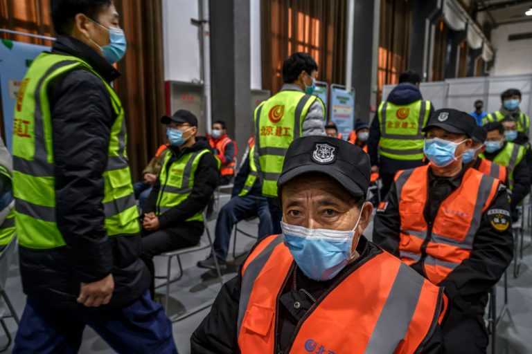 Chinese workers, including security guards, wait to receive a COVID-19 injection at a mass vaccination center for Chaoyang District on January 15, 2021 in Beijing, China. The CCP’s vaccines are living up to the notoriously poor quality standards the world has come to expect from made-in-China products.
