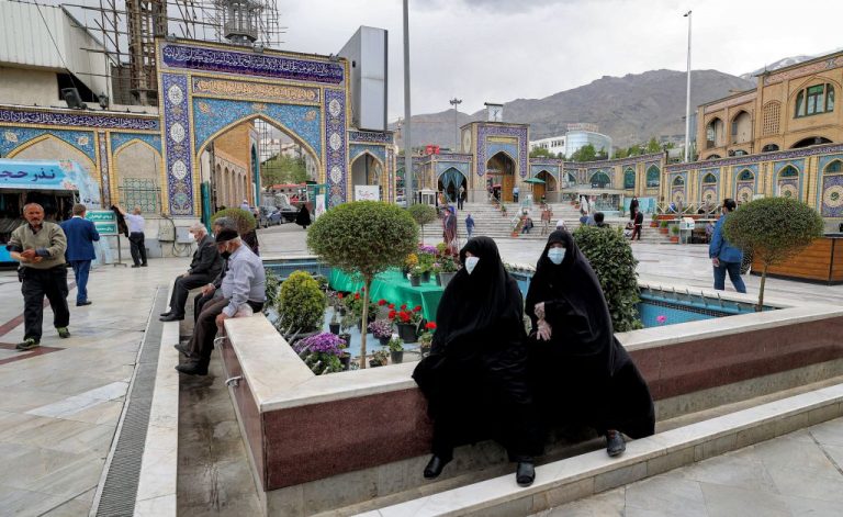 Women sit by a fountain converted into a flowerbed in the courtyard of the Emamzadeh Saleh shrine in the Shemiran district of Iran's capital Tehran on April 14, 2021 on the first day of the Muslim holy fasting month of Ramadan in Iran. The Islamic regime, notorious for its abuse of women’s human rights, was voted to the UN Commission on the Status of Women on April 20 and will join China, Pakistan, Lebanon, and Japan