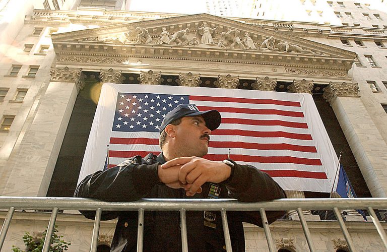 New York Police Officer Chris Hunt stands guard in front of the New York Stock Exchange October 11, 2001 in New York City on the one month anniversary of the terrorist attacks on the World Trade Center and the Pentagon in Washington D.C. A Newsweek expose revealed the Pentagon manages a ‘clandestine army’ 60,000 strong composed of domestic and foreign, online and real life agents operating in society under government-backed false identities.