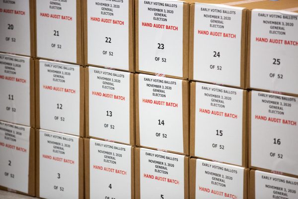 The Arizona audit team is using high-tech equipment to look for irregularities in ballots, such as the lack of folds or the presence of bamboo fibers. Pictured are ballots that were pulled aside for a hand audit by Maricopa County Elections Department staff ahead of the 2020 election in Phoenix, Arizona.