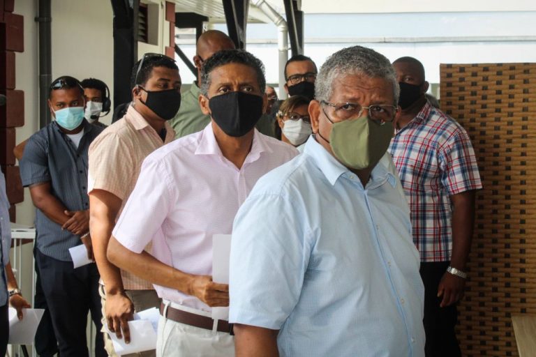 President of Seychelles Wavel Ramkalawan (R) and Former President Danny Faure (2nd R) wait to receive the first dose of the Chinese Communist Party’s Sinopharm injection at the Seychelles Hospital in Victoria, on January 10, 2021.