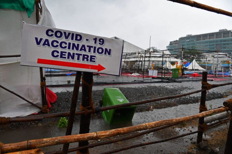 A damaged part of the BKC Jumbo Covid-19 coronavirus vaccination centre is pictured after a portion of the entrance hallway was blown away by the strong winds from cyclonic storm Tauktae in Mumbai on May 17, 2021. Actor Vivek took the Covaxin inactivated virus injection to condition the public for vaccine acceptance. He was taken to hospital unconscious the next morning and died a day later.