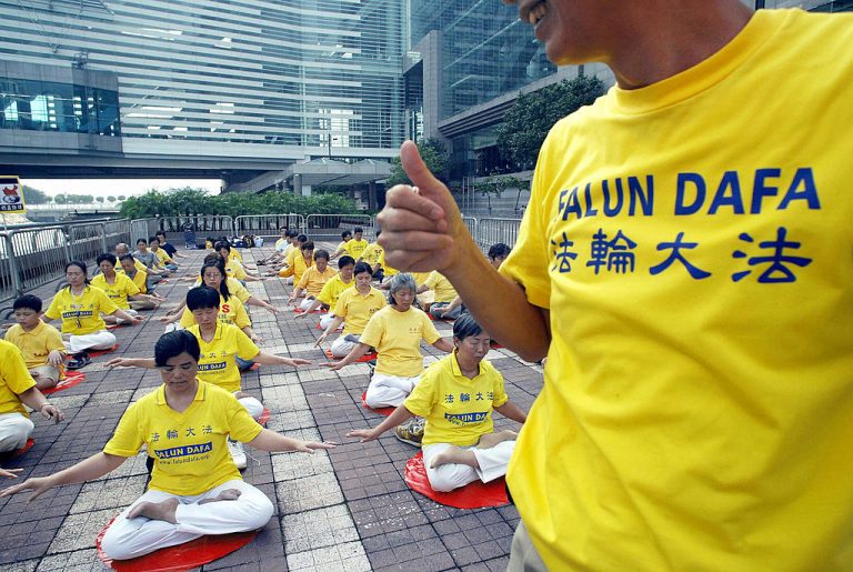 Falun Gong practitioners take part in a silent protest calling to bring former General Secretary of the Chinese Communist Party, Jiang Zemin, to justice in Hong Kong on October 1, 2004. Minghui Publishing was awarded the highly acclaimed Benjamin Franklin Award for its groundbreaking book, Minghui Report: The 20-Year Persecution of Falun Gong in China.