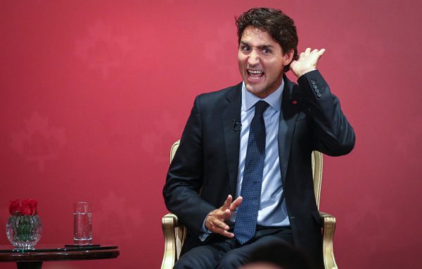 Justin Trudeau acts strange as he attends a Canada-Hong Kong Business Luncheon in Admiralty, Hong Kong on Sep. 6, 2016. Canada's exporting to China scandal with Qiu Xiangguo and Cheng Keding of 15 different fatal pathogens sheds light on the Canadian government's serious conflict of interest with Beijing.