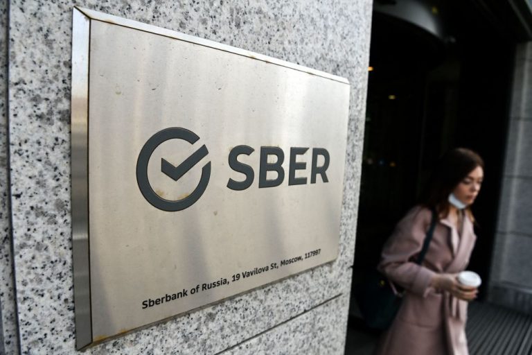 The logo of Russia's state-owned bank Sberbank (reading "Sber") is seen on one of its offices in central Moscow on April 12, 2021. Cyber Polygon 2021 will simulate a “Digital Pandemic” supply chain attack in a collaboration between the World Economic Forum, Interpol, ICANN, Visa, and others