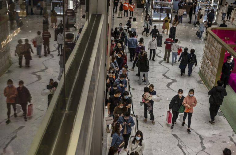 China’s economic growth is being threatened by a new “lying flat” movement among young citizens. Shoppers wait in line outside a Chanel store at a mall on April 18, 2021 in Beijing, China.