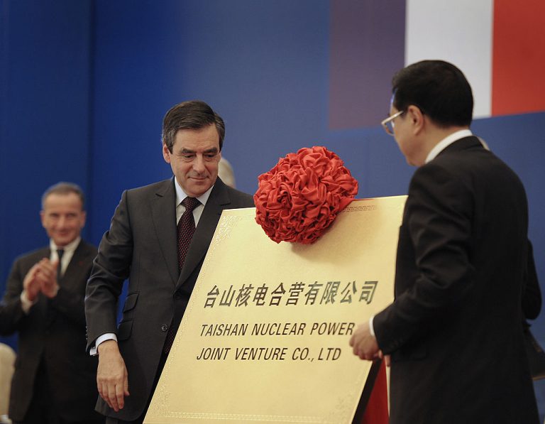 Former French Prime Minister Francois Fillon (2nd-L) and China’s then-Vice Premier Li Keqiang (R) look after the official launch of the Taishan Nuclear Power Plant joint venture project between China and France held at the Great Hall of the People in Beijing, on December 21, 2009. French utility provider EDF’s subsidiary and reactor designer, Framatome, was forced to approach the U.S. government about a fission gas leak at the world’s largest nuclear reactor because of a Pentagon blacklist against the CCP’s CGN.