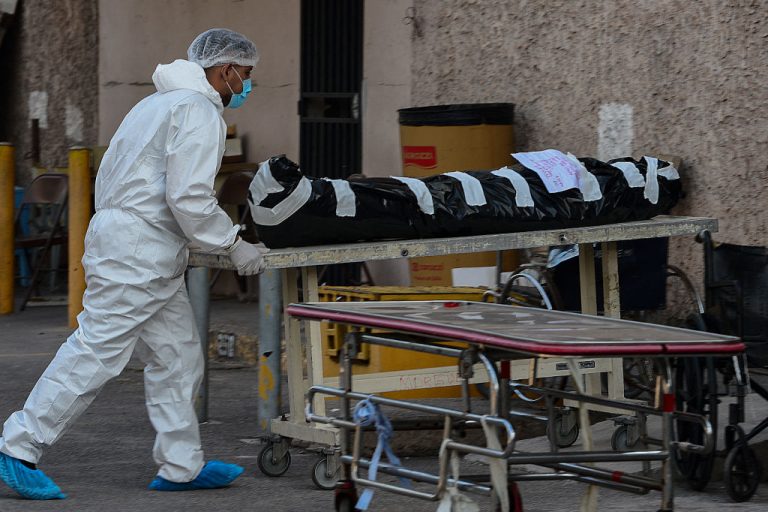 A Health Secretary worker transports the dead body of a COVID-19 victim to the morgue at the Universitary School Hospital in Tegucigalpa, Honduras, on April 27, 2021. Dr. Jane Orient, Executive Director of the Association of American Physicians and Surgeons, says she’s shocked autopsies are not being conducted on people who have died in connection with COVID-19 vaccines.