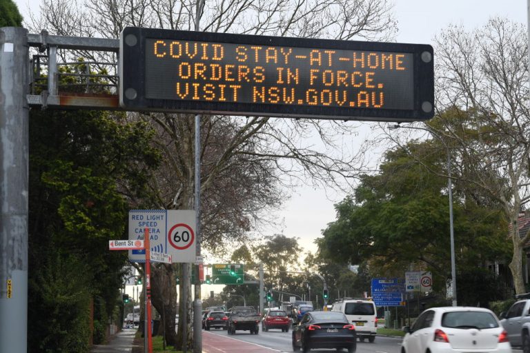 A digital warning sign on Military Road in the suburb of Neutral Bay on July 14, 2021 in Sydney, Australia. The State of New South Wales requested 300 members of Australia’s military be deployed to Sydney to enforce the sixth week of one of the harshest lockdowns in the developing world.