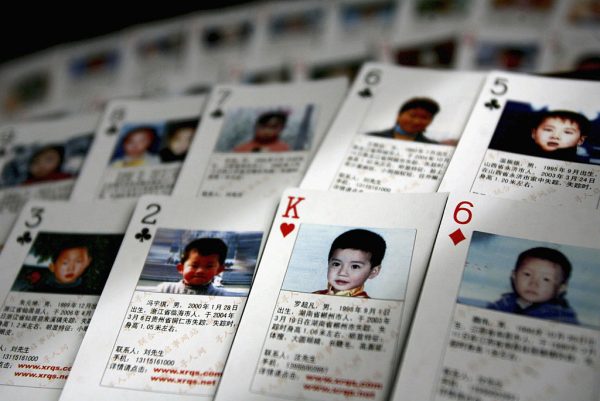 Playing cards showing details of missing children are displayed on March 31, 2007 in Beijing, China. The cards showing photographs and information of 27 missing children were created by Shen Hao, the founder of missing persons website, 'www.xrqs.com'.
