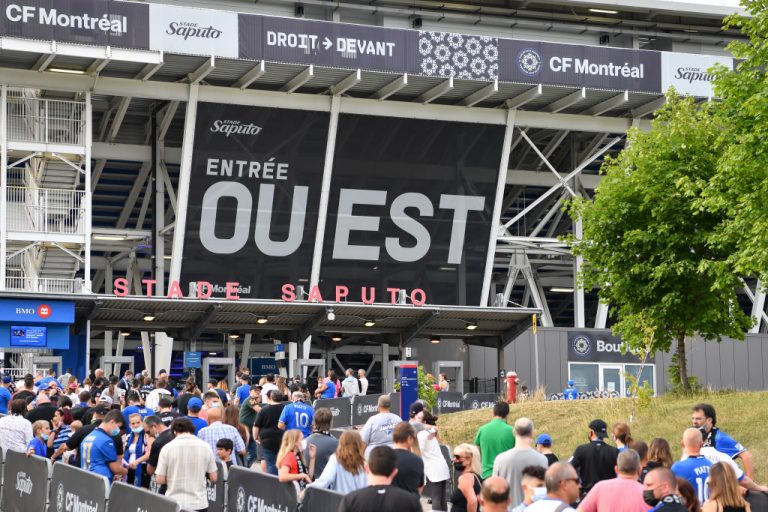 Fans stand in line waiting for entry to Saputo Stadium prior to the MLS game between CF Montreal and FC Cincinnati on July 17, 2021 in Montreal, Quebec, Canada. Premier Francois Legault announced vaccine passports would now be required for the Province’s minority population to continue to participate in society, with an announcement of the specifics coming from Health Minister Christian Dube in the next several days.
