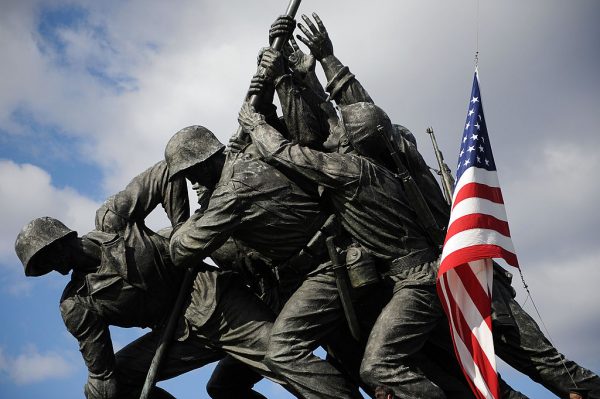 The U.S. flag is raised over the Marine Corps Memorial in Arlington, Virginia on February 23, 2009 during an event honoring veterans of the Battle of Iwo Jima. The Taliban’s Badri 313 special forces published a propaganda photo of their soldiers hoisting the Taliban’s flag in a similar pose in an apparent act of disrespect to the United States.