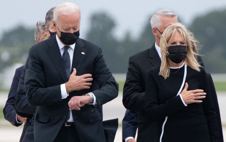 Joe Biden checks the time during the dignified transfer of the remains of a fallen service member at Dover Air Force Base in Dover, Delaware, on Aug. 29, 2021. Biden was put on blast by families of at least four of the thirteen slain soldiers, both for checking his watch and talking about his son Beau Biden, former Attorney General of Delaware, who died at age 46 from cancer in an attempt to relate his own grief to the families.