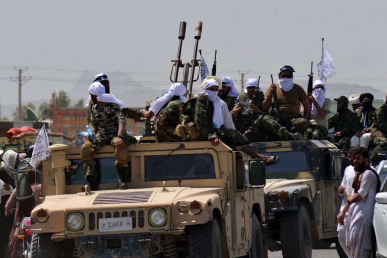 Taliban fighters atop Humvee vehicles parade along a road to celebrate after the US pulled all its troops out of Afghanistan, in Kandahar on September 1, 2021 following the Talibans military takeover of the country.
