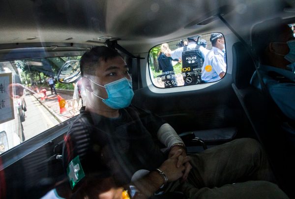 Defendant Tong Ying-Kit, 24, arrives at court after being accused of deliberately driving his motorcycle into a group of police officers on July 6, 2020 in Hong Kong. Tong is the first person to be charged for “incitement to secession” and “terrorist activities” under the Hong Kong National Security Law.