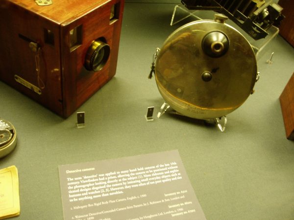 An antique spy camera at the Museum of History and Science. These cameras were put on a string under a waistcoat with the lens poking out a buttonhole. )