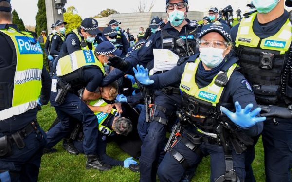 Police tackle protesters in Melbourne on September 5, 2020, during an anti-lockdown rally. Victoria Premier Dan Andrews was a personal signatory to the Chinese Communist Party’s hegemony project, the Belt and Road Initiative, which has since been rescinded by the Australian federal government after Andrews severely injured his back falling down a staircase. 