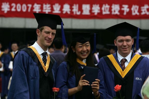 Students graduate during a ceremony held for 3,768 masters and 898 doctorates being given out at the Tsinghua University on July 18, 2007 in Beijing. Tsinghua admits of its own accord to be a training ground for Marxist propagandists who go on to work both in the regime’s demagoguery machine and global blue-chip corporations. 