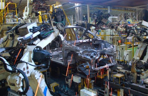 Robots assemble a new General Motors Daewoo vehicle, the KALOS, at the Bupyung plant on October 28, 2002, in Inchon, South Korea. Keith Krach was the youngest Vice President in General Motors’ history and founded one of the company’s earliest robotics lines before moving on to Silicon Valley. 