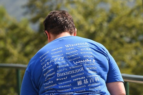 A man attending the Wikimania 2016 meeting, wears a shirt reading "Wikipedia" in different languages, at Esino Lario near Lecco on June 24, 2016. Google’s reliance on Wikipedia helped the Chinese Communist Party spread official propaganda about the South China Sea to the English-speaking world.