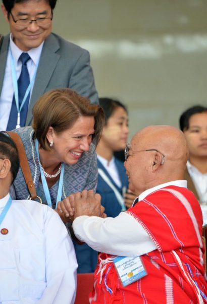 THEN: General Mutu Say Poe (R), chairman of the Karen National Union (KNU), shakes hands with Christine Schraner Burgener, UN special envoy on Myanmar, during a photo session for the third session of the Union Peace Conference in Naypyidaw on July 11, 2018. - Myanmar military officials on July 11 said stalled peace talks were "drowning" the country, blaming ethnic armed groups for a lack of control as fighting continues to rage in the country's northern borderlands. 