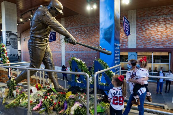 The Miller girls pay their respect to Hank Aaron the baseball player and beloved community member on January 23, 2021, in Atlanta, Georgia. Hank played for the Atlanta Braves and was known as the Home-Run King.
