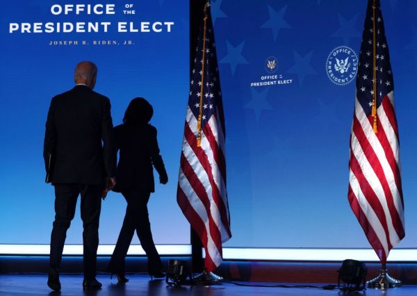 U.S. President-elect Joe Biden (L) and U.S. Vice President-elect Kamala Harris (R) leave after he laid out his plan on combating the coronavirus at the Queen theater on January 15, 2021, in Wilmington, Delaware. President-elect Biden is announcing his plan to administer COVID-19 vaccines to Americans. 