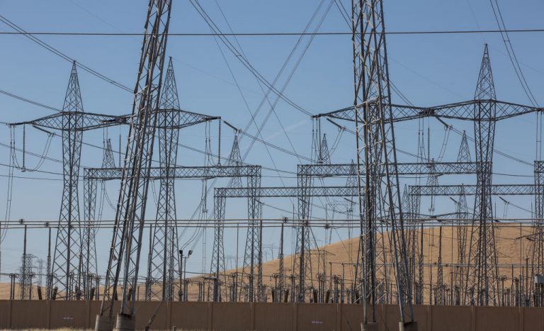 Massive electrical transmission lines are viewed at a transfer station near Santa Nella, California.