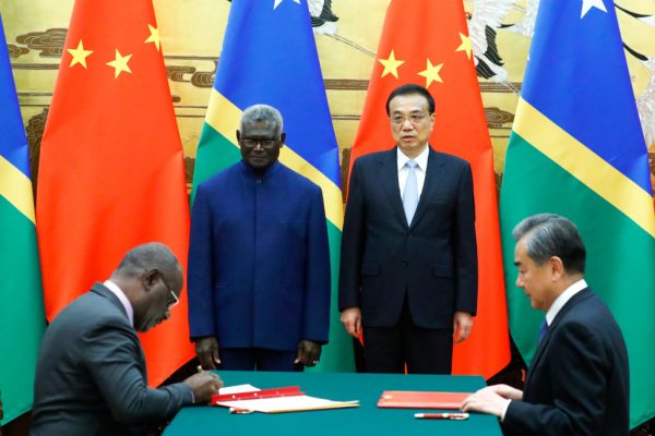Solomon Islands Prime Minister Manasseh Sogavare, Solomon Islands Foreign Minister Jeremiah Manele, Premier Li Keqiang and State Councillor and Foreign Minister Wang Yi attend a signing ceremony in Beijing in September of 2019 after Sogavare severed a 36-year relationship with Taiwan after being tempted by the Communist Party’s benefits.