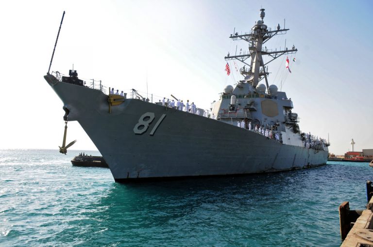 This picture taken on March 1, 2021 shows a view of the U.S. Navy guided-missile destroyer USS Winston S. Churchill (DDG 81), part of Destroyer Squadron 2, arriving in Port Sudan. Commander Lucian Kins has been relieved of duty. While an official spokesperson said Kins lost the confidence of superior officers for refusing a “lawful order,” anonymous officials told Associated Press it was because his COVID-19 vaccine religious exemption was denied, yet he still refused injection.
