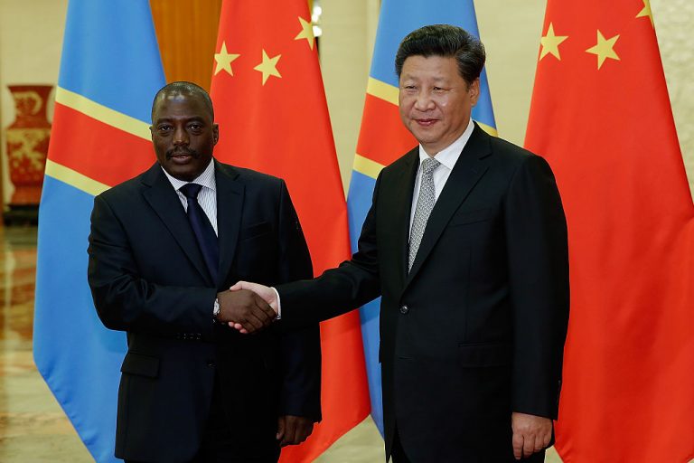 Chinese President Xi Jinping (R) shakes hands with then President Of Democratic Republic Of The Congo Joseph Kabila (L) at The Great Hall Of The People on September 4, 2015 in Beijing, China.