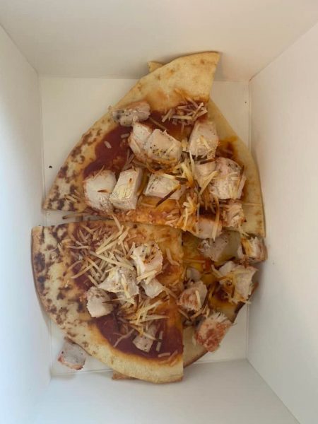 Picture of a clearly uncooked pizza provided to inmates of the Calgary Westin Hotel Confidential Federal Quarantine Site