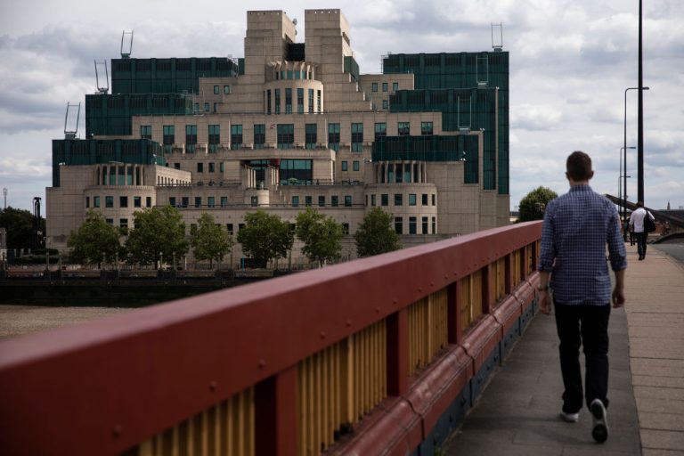LONDON, ENGLAND - AUG. 17: A man walks over Vauxhall Bridge towards the MI6 headquarters on Aug. 17, 2018 in London, England. China has published a spoof video targeting the UK's MI6 intelligence agency.