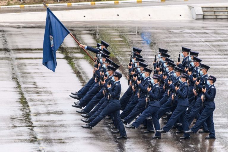 Police officers perform a goose-stepping march, the same style used by police and troops by the Chinese communist regime. They performed the authoritarian-style march at the city's police college to mark the National Security Education Day in Hong Kong on April 15, 2021.