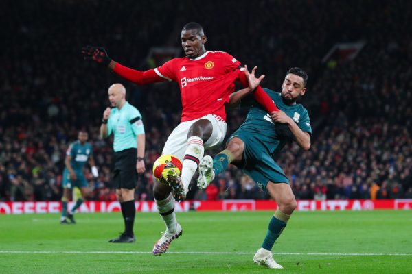 Neil Taylor of Middlebrough battles for possession with Paul Pogba of Manchester United during the Emirates FA Cup Fourth Round
