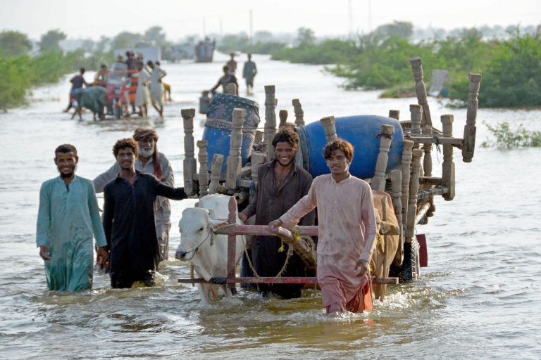 pakistan-flooding-people-flee_GettyImages-1242781312.jpg