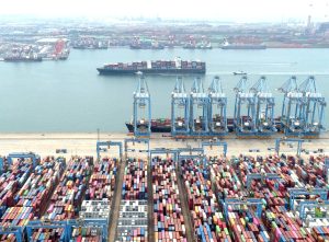 Containers and cargo vessels at the Qingdao port