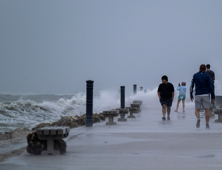 People walk at the Inlet State Park before the expected arrival of Tropical Storm Nicole in Fort Pierce, Florida, U.S. November 9, 2022. (Image: Screenshot/ REUTERS)