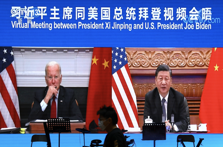 A screen shows Chinese President Xi Jinping attending a virtual meeting with U.S. President Joe Biden via video link, at a restaurant in Beijing, China November 16, 2021. (Image: Screenshot / REUTERS)