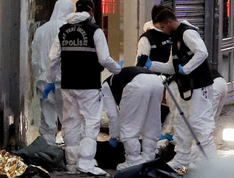 Police members work near the bodies of unidentified people after an explosion on busy pedestrian Istiklal street in Istanbul, Turkey, November 13, 2022. (Image: Screenshot / REUTERS)