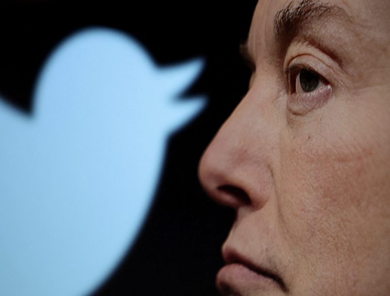 Twitter logo and a photo of Elon Musk are displayed through magnifier in this illustration taken October 27, 2022. (Image: Screenshot / REUTERS)