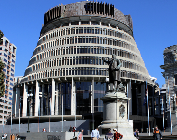 People stand outside the executive wing of the New Zealand Parliament complex, popularly known as "Beehive" because of the building’s shape, in Wellington, New Zealand, July 23, 2020. (Image: Screenshot / REUTERS)