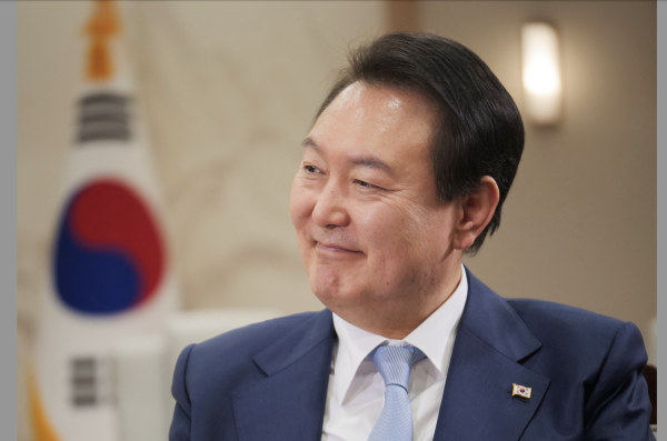 South Korean President Yoon Suk-Yeol smiles during an interview with Reuters in Seoul, South Korea, November 28, 2022. (Image: Screenshot / REUTERS)