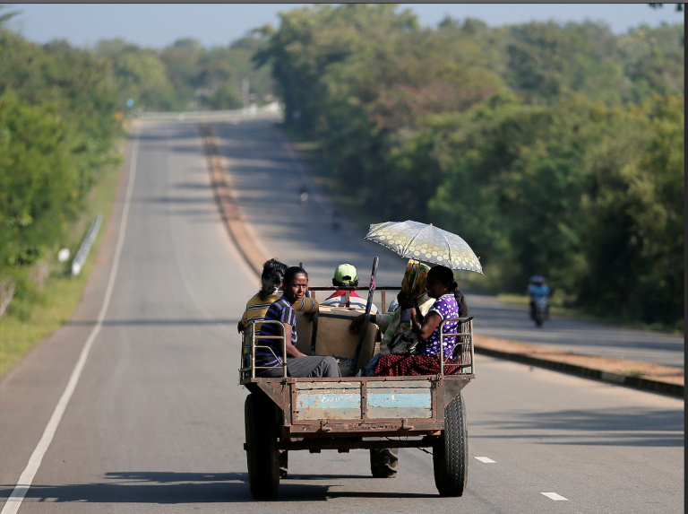Villagers travel in a tractor on a newly built road in Hambantota, Sri Lanka March 24, 2019. (Image: Screenshot / Reuters)