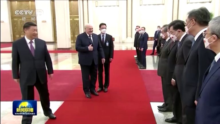 Chinese President Xi Jinping (left) looks on while Belarus President Alexander Lukashenko (center) checks on a delegation of high-ranking Chinese officials during his visit to Beijing on Mar. 1, 2023.