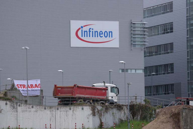 a-dump-truck-stands-at-the-construction-site-of-the-new-infineon-smart-power-fab-semiconductor-factory-on-may-02-2023-in-dresden-germany-german-chip-producer-infineon-is-one-of-the-partners-joining-taiwanese-microchip-giant-tsmc-to-build-an-even-bigger-microchip-producing-plant-in-dresden-germany