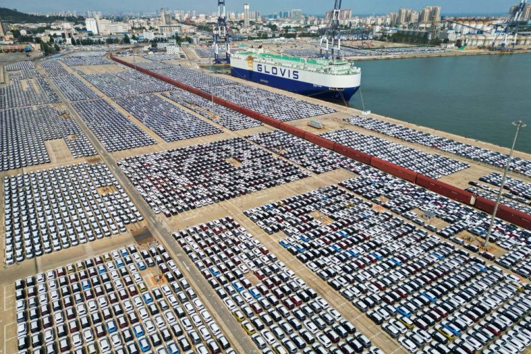 an-aerial-photo-on-june-1-2023-shows-rows-of-a-vast-possibly-ev-park-in-yantai-port-in-china-s-eastern-shandong-province
