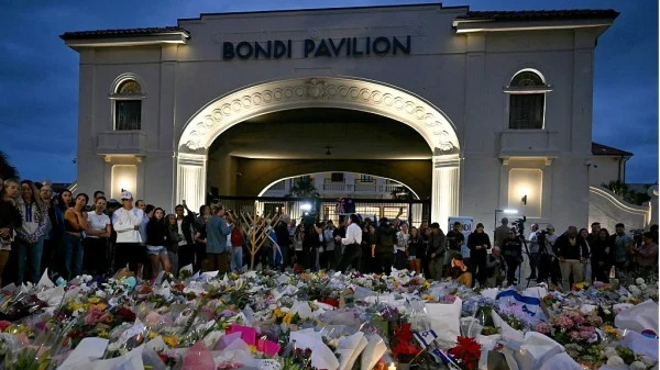 People gather near Bondi Pavilion in Sydney on December 15, 2025, to mourn victims of the Hanukkah shooting.